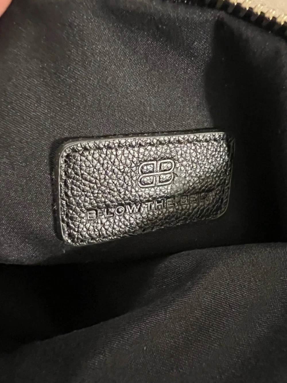 B-Low the Belt Perforated Leather Foldover Tassel Clutch